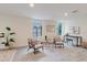 Bright and airy living area with two chairs, side tables, and large windows offering natural light at 138 69Th N Ave, St Petersburg, FL 33702
