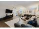 Spacious living room featuring a sectional sofa, open layout connecting to the dining area and kitchen at 138 69Th N Ave, St Petersburg, FL 33702