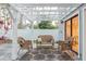 Relaxing outdoor patio with wicker furniture set under a pergola, perfect for entertaining at 138 69Th N Ave, St Petersburg, FL 33702