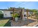 Backyard featuring a covered patio with wood beams and low-maintenance landscaping at 14 S Meteor Ave, Clearwater, FL 33765