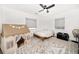 This bedroom offers a playful tent, ceiling fan, and abundant natural light at 14 S Meteor Ave, Clearwater, FL 33765