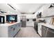 Modern kitchen with stainless steel appliances, a large center island, and white and gray cabinetry at 14 S Meteor Ave, Clearwater, FL 33765