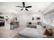 Open-concept living room with kitchen view, featuring a comfortable sectional sofa and modern bar stool seating at 14 S Meteor Ave, Clearwater, FL 33765
