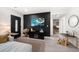Cozy living room with black accent wall, modern furnishings, and a stylish entry door at 14 S Meteor Ave, Clearwater, FL 33765