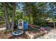 Backyard playground offers slide, climbing structure, trampoline, and car at 14 S Meteor Ave, Clearwater, FL 33765