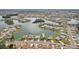 Stunning aerial view of beautiful waterfront homes offering tranquil living and lake access at 1405 W Del Webb Blvd, Sun City Center, FL 33573