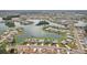 Breathtaking aerial view showcasing waterfront homes in a picturesque lake community at 1405 W Del Webb Blvd, Sun City Center, FL 33573