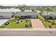 Beautiful waterfront home with meticulously landscaped yard and brick paved driveway at 1405 W Del Webb Blvd, Sun City Center, FL 33573