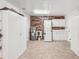 The well-organized garage includes a utility sink, water heater, washer/dryer hookups, and ample white storage cabinets at 1405 W Del Webb Blvd, Sun City Center, FL 33573