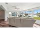 Inviting living room with hardwood floors, neutral decor, and large windows overlooking the lake at 1405 W Del Webb Blvd, Sun City Center, FL 33573