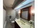 Bathroom featuring a vanity, toilet, and shower/tub combination with a shower curtain at 1654 S Lake Ave # 2, Clearwater, FL 33756