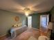 Bedroom view showcasing walk-in closet and hallway access, enhancing the room's functionality at 1654 S Lake Ave # 2, Clearwater, FL 33756