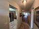 Hallway with tile flooring leading to an open living space and modern kitchen at 1654 S Lake Ave # 2, Clearwater, FL 33756