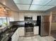 Bright kitchen with white cabinets and stainless steel appliances at 1654 S Lake Ave # 2, Clearwater, FL 33756