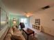 Inviting living room with a comfortable sofa, soft natural light, and carpeted flooring at 1654 S Lake Ave # 2, Clearwater, FL 33756