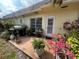 Outdoor patio featuring a grill and lush landscaping, ideal for entertaining at 1654 S Lake Ave # 2, Clearwater, FL 33756