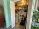 Storage closet with water heater and shelves, providing plenty of space at 1654 S Lake Ave # 2, Clearwater, FL 33756