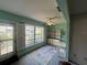 Bright sun room with large window, a ceiling fan, and built in shelving, perfect for relaxing at 1654 S Lake Ave # 2, Clearwater, FL 33756