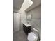 Modern bathroom with marble wall and updated toilet at 1710 Tallowtree Cir, Valrico, FL 33594