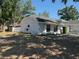 View of the home's manicured front yard at 1710 Tallowtree Cir, Valrico, FL 33594