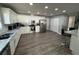 Spacious kitchen features white cabinets, stainless steel appliances, marble countertops, and a breakfast bar at 1710 Tallowtree Cir, Valrico, FL 33594