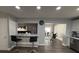 Eat-in kitchen bar with stylish stools and marble countertops at 1710 Tallowtree Cir, Valrico, FL 33594