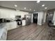Spacious kitchen features white cabinets, stainless steel appliances, marble countertops, and a breakfast bar at 1710 Tallowtree Cir, Valrico, FL 33594