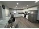 Spacious kitchen features white cabinets, stainless steel appliances, marble countertops, and a breakfast bar at 1710 Tallowtree Cir, Valrico, FL 33594