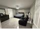 Spacious main bedroom with a modern design and sitting area at 1710 Tallowtree Cir, Valrico, FL 33594