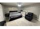 Spacious main bedroom with a modern design and sitting area at 1710 Tallowtree Cir, Valrico, FL 33594