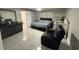 Spacious main bedroom with a modern design and sitting area at 1710 Tallowtree Cir, Valrico, FL 33594