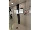 Updated walk-in shower with marble wall at 1710 Tallowtree Cir, Valrico, FL 33594