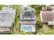 Aerial view showcasing the private pool and back yard of the home at 1719 Bayhill Dr, Oldsmar, FL 34677
