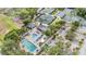 Stunning aerial view of community pools, tennis courts, clubhouse and parking at 1719 Bayhill Dr, Oldsmar, FL 34677
