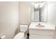 Powder room with toilet, sink, vanity, mirror and lighting at 1719 Bayhill Dr, Oldsmar, FL 34677
