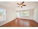 Bedroom offers wood floors, windows, and neutral paint at 1719 Bayhill Dr, Oldsmar, FL 34677