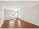 Bright bedroom features laminate floors, fresh paint and multiple windows for natural light at 1719 Bayhill Dr, Oldsmar, FL 34677