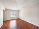 Bedroom features wood floors and ample natural light at 1719 Bayhill Dr, Oldsmar, FL 34677