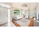 Bright living room featuring a large window, neutral decor, and stylish furnishings creating a welcoming atmosphere at 1719 Bayhill Dr, Oldsmar, FL 34677