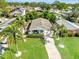 Aerial view of a charming home with lush landscaping and mature palm trees at 1727 New Hampshire Ne Ave, St Petersburg, FL 33703