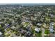 Aerial view of the neighborhood showing lush landscaping, mature trees, and well-maintained streets near the waterfront at 1727 New Hampshire Ne Ave, St Petersburg, FL 33703