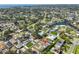 Aerial view of a waterfront community featuring a charming home with mature trees at 1727 New Hampshire Ne Ave, St Petersburg, FL 33703