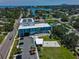 A view of a modern aquatic center with pool, splash pad, playground and parking near local neighborhoods at 1727 New Hampshire Ne Ave, St Petersburg, FL 33703