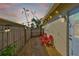 Quaint backyard patio with stone pavers, string lights, privacy fence and tropical landscape at 1727 New Hampshire Ne Ave, St Petersburg, FL 33703