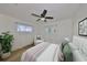 Comfortable bedroom filled with natural light, neutral tones, and a calming plant at 1727 New Hampshire Ne Ave, St Petersburg, FL 33703