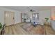 Bright, open-concept living area showcasing natural light, hard wood floors, and stylish decor at 1727 New Hampshire Ne Ave, St Petersburg, FL 33703