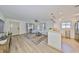 Open-concept living area with lots of natural light, hard wood floors, and stylish decor at 1727 New Hampshire Ne Ave, St Petersburg, FL 33703