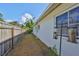 Side yard area with a privacy fence and space for garden or outdoor storage at 1727 New Hampshire Ne Ave, St Petersburg, FL 33703