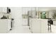 Modern kitchen featuring stainless steel appliances, white cabinetry, and a functional center island at 1812 Tropical Oasis Ave, Plant City, FL 33565