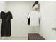 Organized walk-in closet featuring shelving, hanging rods, and storage for clothing and accessories at 1812 Tropical Oasis Ave, Plant City, FL 33565